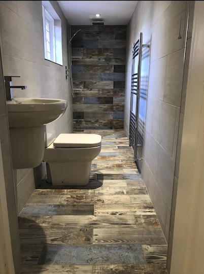 Modern wet room conversion with glass partition in Rustington