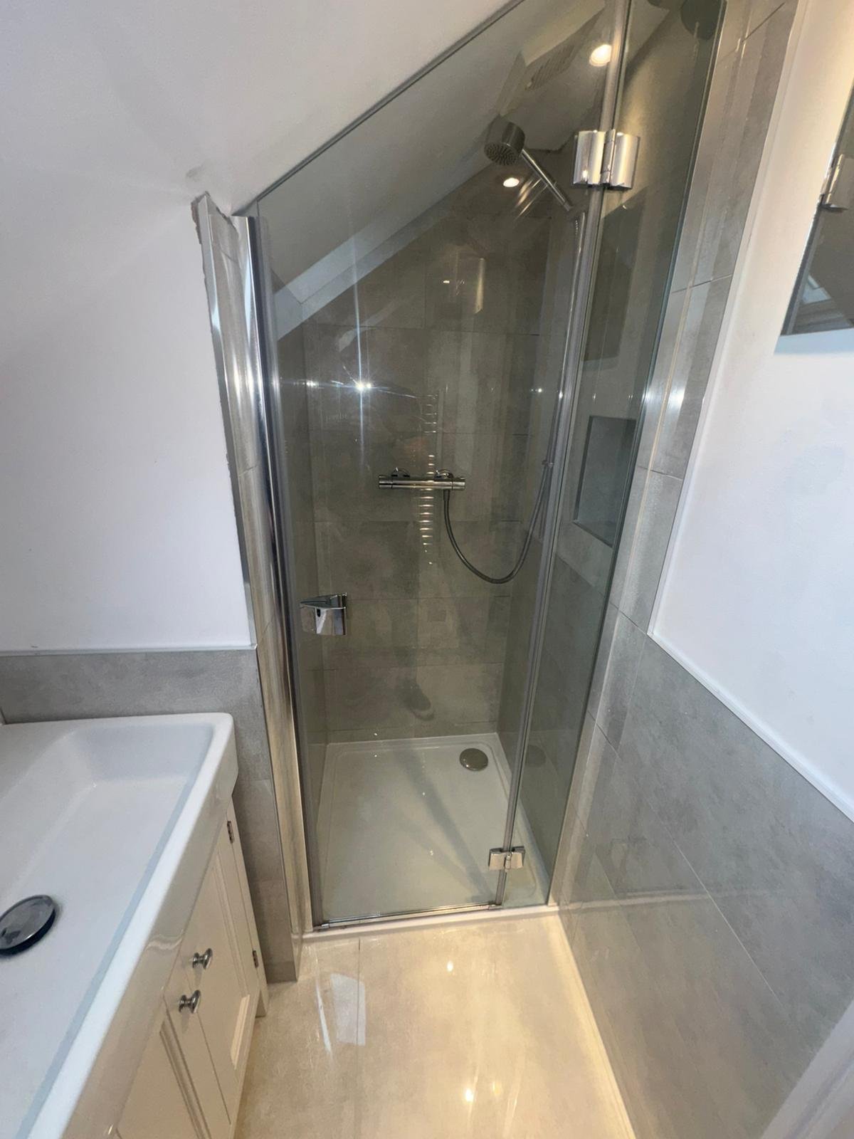 Re-tiled, watertight loft shower enclosure after a leak repair in West Sussex — Adsett Bathrooms