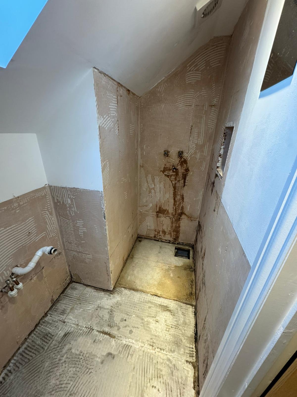 Shower walls and floor prepared and re-piped before re-tanking and tiling by Adsett Bathrooms in West Sussex