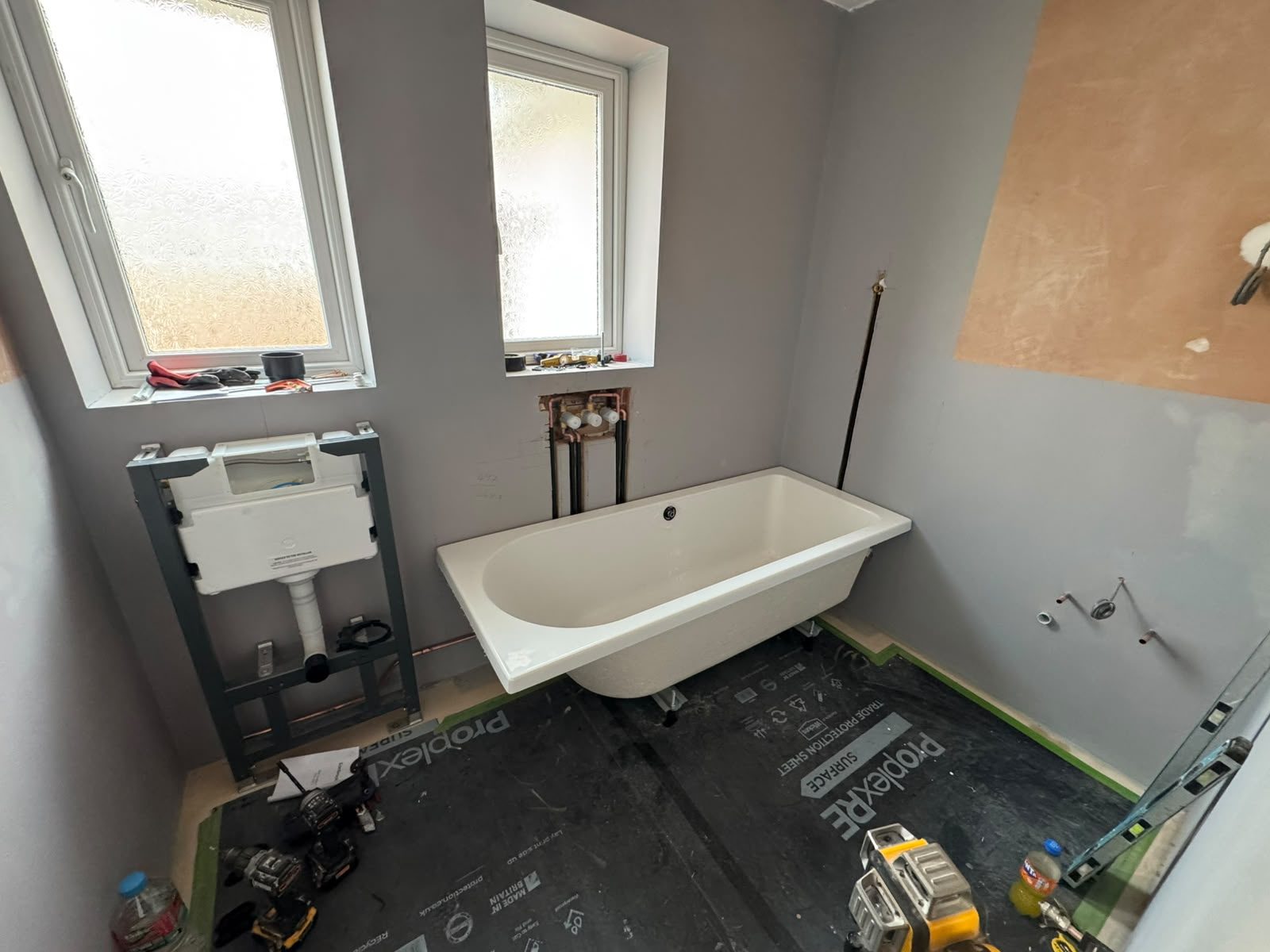 New double-ended bath and concealed cistern frame during first fix