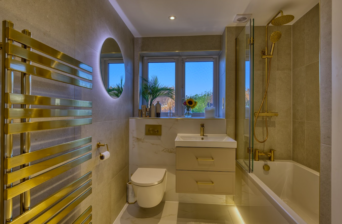 Full view of completed Littlehampton bathroom with gold accents